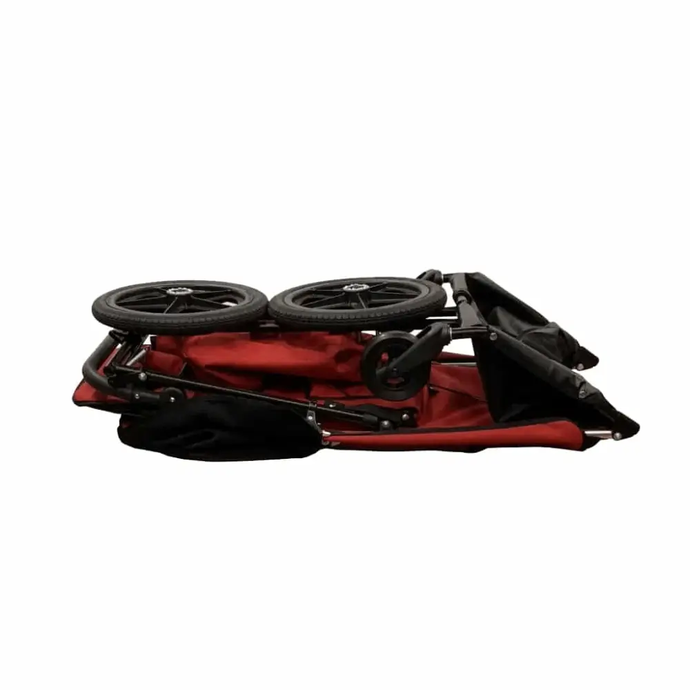 Compact red stroller folded for easy storage and transport