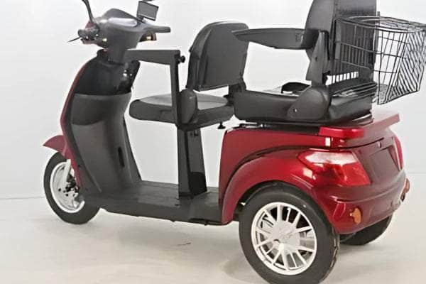 EMS 2S600 Double Seat Electric Mobility Scooter featuring two comfortable seats, a rear basket for storage, and a sleek red design, ideal for elderly or disabled users seeking mobility and convenience.