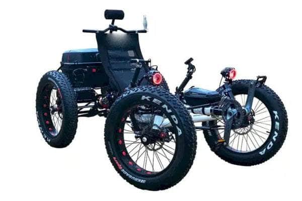 Electric Fat Tire Recumbent Quad with large Kenda tires, designed for stable off-road riding, featuring a comfortable seating position and rear lights for visibility.