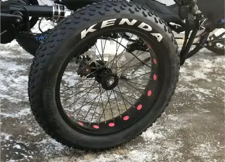 Close-up of the Kenda fat tire on the Electric Fat Tire Recumbent Quad, showcasing its durable build for all-terrain stability and comfort.