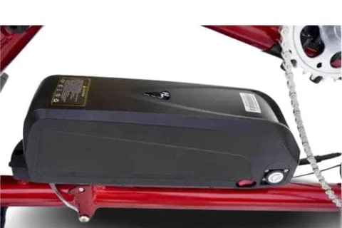 Electric tandem trike with a powerful black battery mounted on the sleek red frame.