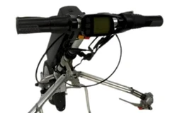 Electric wheelchair motor attachment featuring an LED front light and horn for enhanced nighttime visibility and safety.