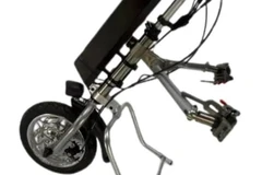 Close-up of the twist throttle control for the electric wheelchair motor attachment, designed for ease of speed adjustment.