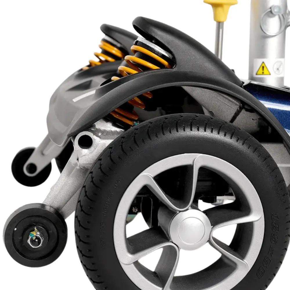 Close-up of a scooter's rear wheel showcasing the suspension and tire design