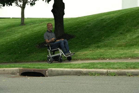 Lightweight eVolt Traveler Power Chair in action, ideal for stable mobility.