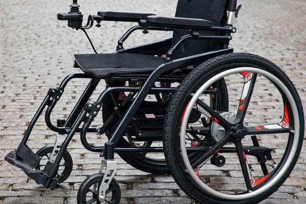 Model H Hybrid Chair showcasing dual mobility modes with a sleek, black design.
