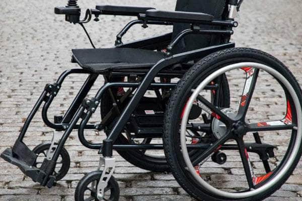 Side view of the Model H Hybrid Chair showcasing safety features like flat-free wheels and anti-tippers.