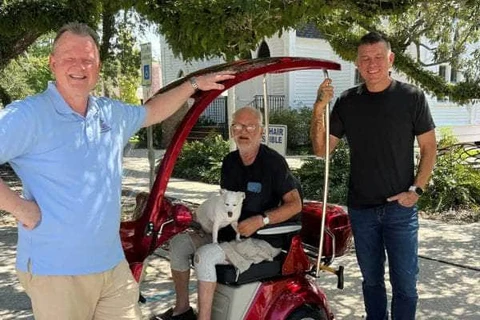 Ergonomic and high-back adjustable seating on a red four-wheel electric golf mobility scooter