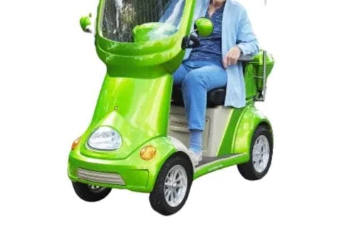 Bright LED lights on a red four-wheel electric golf mobility scooter enhancing visibility and safety
