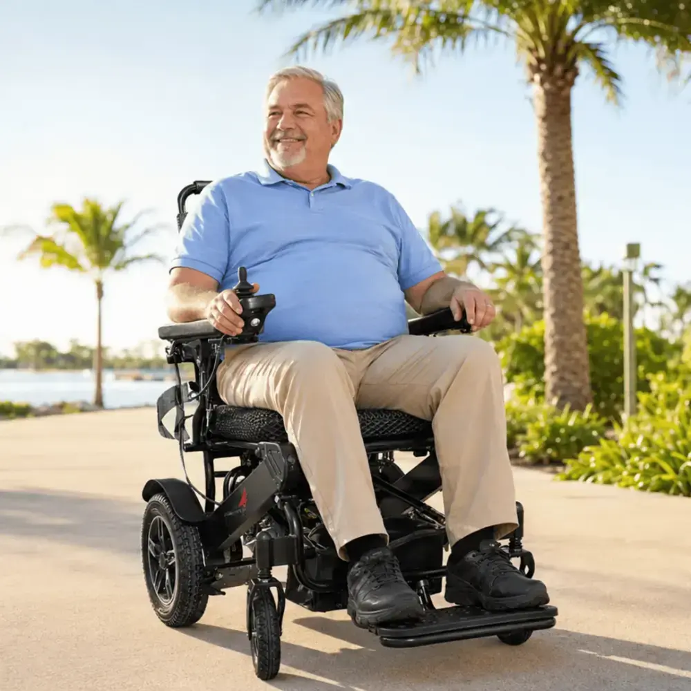 A happy rider driving the SkyHawk power wheelchair outdoors