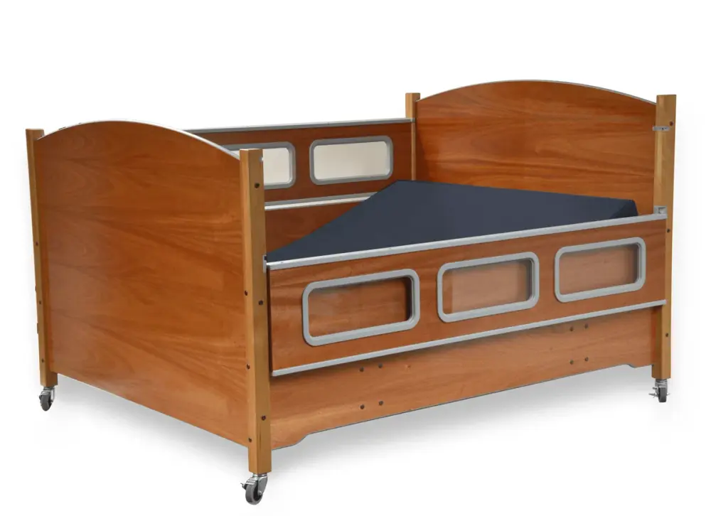 Adjustable wooden hospital bed with safety rails and mattress