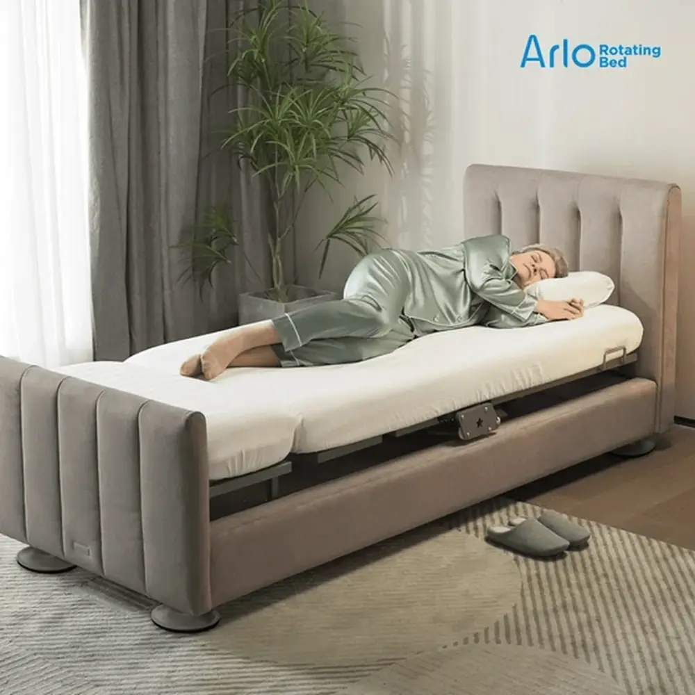 Caregiver assisted by the StarSleep Arlo rotating bed at home